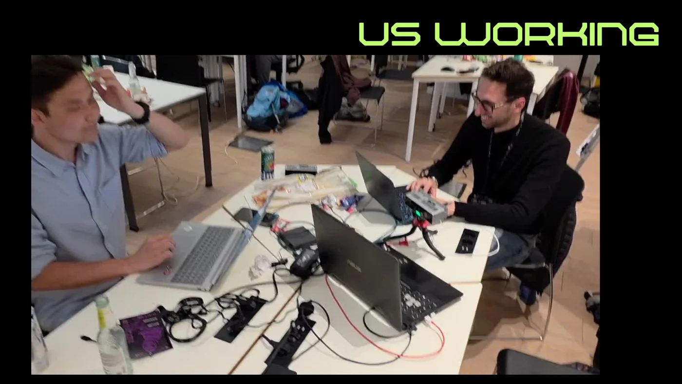 The Techtonics team at work during GDG AI Hack Milan with the Luxonis camera on the desk